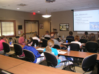 People listing to education session in Grand Prix Seminar Room